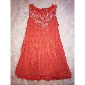 Peach colored dress with white tribal design